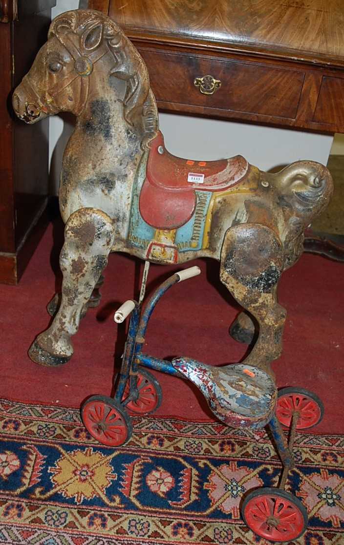 A painted metal fairground horse, together with a child's painted metal tricycle (2)