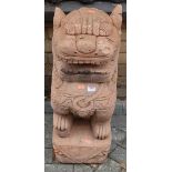 A contemporary reconstituted stone garden figure of a seated Chinese dog of Fo (with some damage and