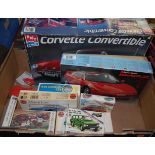 A box of plastic kits to include AMT Ertl Corvette Convertible, Airfix Aston Martin DB5, Airfix 1904