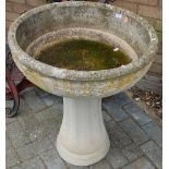 A reconstituted stone pedestal circular bird bath, dia.59cm