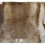 A contemporary hide skin rug, approx 130x80cm