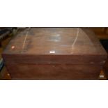 An early 20th century hardwood hinge top work box, having end carry handles, width 73cm