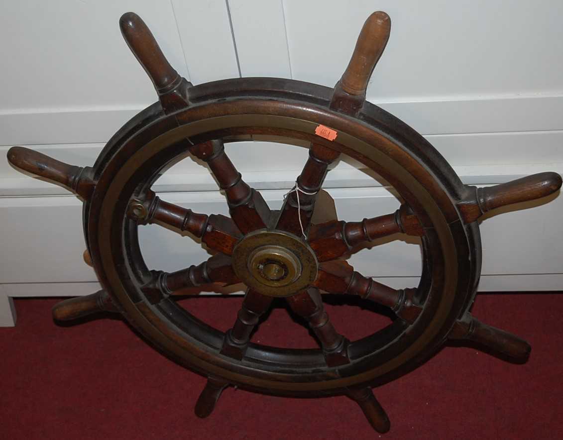 An oak and mahogany brass bound ships wheel, dia.75cmCondition report: UK Shipping on this lot £25