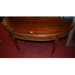 A circa 1900 mahogany and rosewood crossbanded D-end extending dining table, having a fold-over
