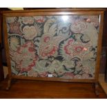 A Victorian mahogany and floral tapestry embroidered pole screen; together with a Victorian mahogany