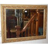 A contemporary floral gilt decorated bevelled rectangular wall mirror, 62x82cm