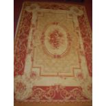 A Continental machine woven floral cream and red ground rug, 234x158cm