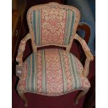 A Louis XV style limed wood and floral stripe upholstered fauteuil; together with a similar white