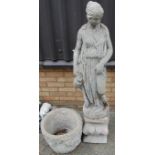 A reconstituted stone garden statue of the Venus di Milo, holding a water-jug and raised on