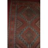 A Caucasian woollen and faded hall runner, having an all over floral geometric pattern, 214x106cm