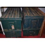 A set of four green painted metal munitions type trunks