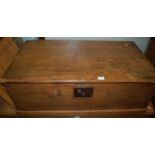 A Victorian stained pine hinge topped tool chest, having iron end carry handles, w.87cm