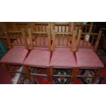 A set of eight rustic oak stickback dining chairs, having removable pad seats