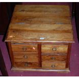 A contemporary Eastern hardwood low chest, fitted with six short drawers, w.60cm