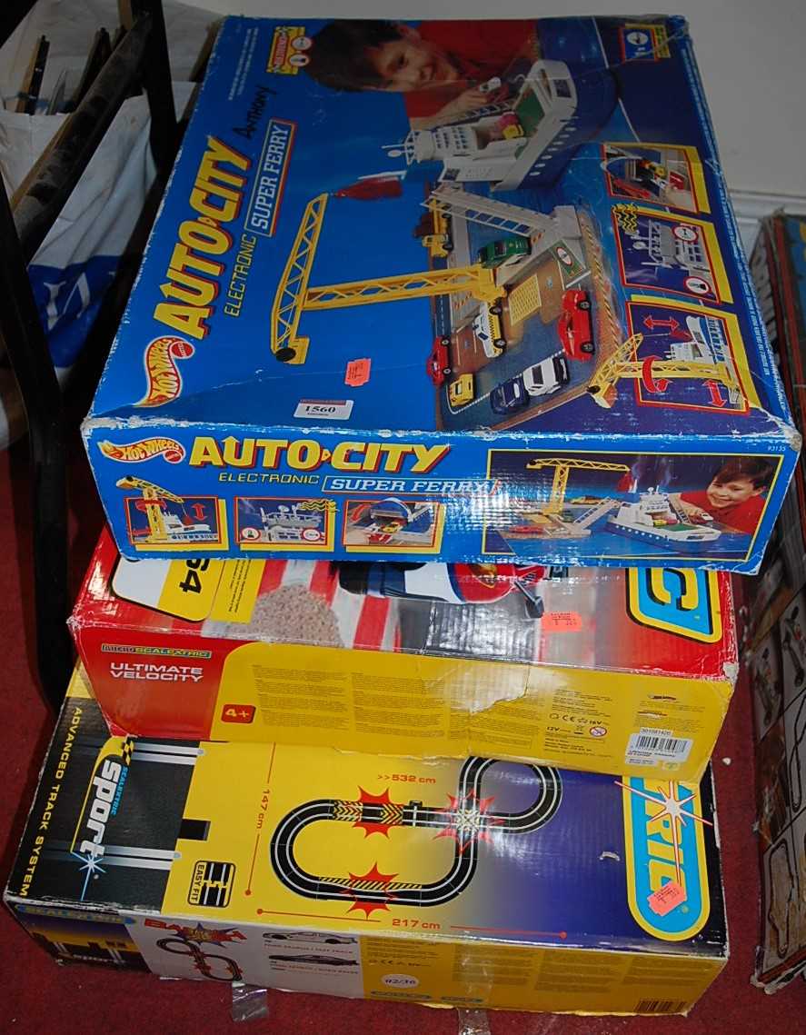 A boxed Scalextric Crash and Bash set, a boxed Micro Scalextric Ultimate Velocity set, and a Hot