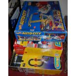 A boxed Scalextric Crash and Bash set, a boxed Micro Scalextric Ultimate Velocity set, and a Hot