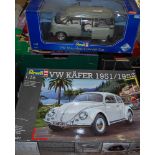A boxed Revell VW Microbus concept car, and a 1/16 scale Revell VW Beetle plastic kit