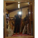 A modern gilt composition bevelled rectangular wall mirror, 150x120cm