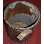 An embossed copper swing handled circular coal bucket