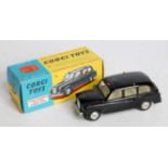A Corgi Toys No. 418 Austin Taxi comprising of black body with lemon interior and spun hubs,