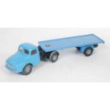 A Spot-On No. 106 Austin articulated flat bed lorry comprising of blue cab with black chassis and