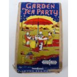 A Crescent Toys Garden Tea Party gift set, comprising of red table with orange plastic parasol, four