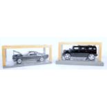 Two plastic kit built display models to include a Hummer and a Mustang GT350H both housed in