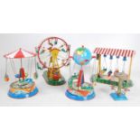 A collection of various boxed and loose modern release tinplate fairground accessories and clockwork
