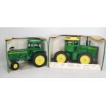 A John Deere ERTL large scale diecast group to include a John Deere Generation 2 tractor, and a 1/16