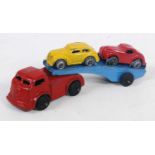 A Barclay Made in USA articulated car transporter with car load, comprising of red tractor unit with