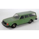 A 'Made in Finland' plastic scale model of a Volvo 245DL estate car, finished in green with black