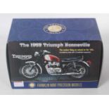 A Franklin Mint Precision models 1/10 scale model of a Triumph 1969 Bonneville housed in the