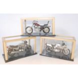 Three various glass cased hand built 1/12 scale motorcycle Airfix and similar kits to include a