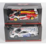 A UT Models Maclaren Collection boxed race car diecast group, both 1/18 scale to include Ref. Nos.