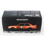 A Minichamps Model No. 882039 1/18 scale model of a BMW M3 DTM 1988 race car finished in orange with