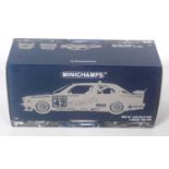 A Minichamps No. 922042 1/18 scale model of an H Becker DTM 1992 BMW M3 race car, finished in dark