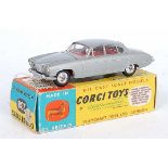 A Corgi Toys No. 238 Jaguar Mk 10 comprising silver body with red interior and spun hubs, housed