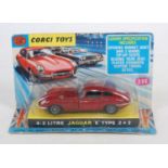 A Corgi Toys No. 335 4.2L Jaguar E-type 2+2 race car, comprising of red body with black interior and