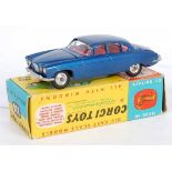 A Corgi Toys No. 238 Jaguar Mk 10 comprising of metallic dark blue body with red interior and spun