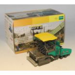 An NZG Model No. 744 1/50 scale model of a Vogele Super 18 03-2 wheeled paver, housed in the