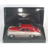 A Minichamps No. 139950 1/18 scale model of a Bentley S2 1954 saloon finished in red and silver as