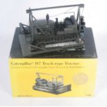 A Norscot model No. 386 1/25 scale model of a Caterpillar D7 track type tractor, military issue,