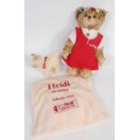 A Steiff Heidi teddy bear, white tag to ear numbered 660788, brown/blond mohair, wearing felt