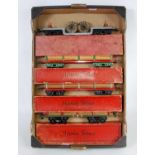 Four No. 2 Hornby bogie wagons: 1927-30 LMS timber, olive green base, red stanchions, original 3-