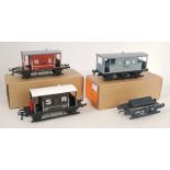 Four Bernard Ridgley wagons:- one each SR/NE/LMS brakes and a GW shunters truck (M-BM)