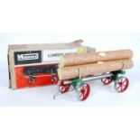 A Mamod LW1 lumber wagon of usual specification comprising green body with red spoked hubs and log