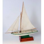 A Star Yachts of Birkenhead wooden sailing yacht, finished in white and green and titled Northern