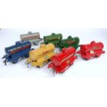 Seven assorted Hornby pre-war tank wagons:- Esso Buff, Redline Glico, Castrol, Power Ethyl, Pool,