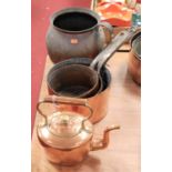 A 19th century copper range kettle together with three 19th century graduated copper saucepans,