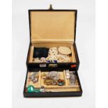 A leather clad jewellery box and contents to include malachite pendant brooch on sterling silver